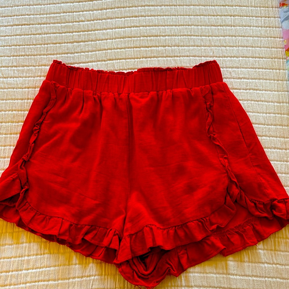 New In red shorts. Size Large.